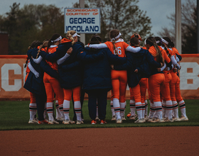 SU softball players defend coach Shannon Doepking